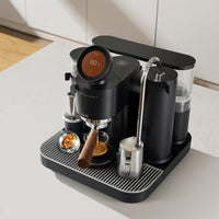Meraki Gen 2 espresso machines in white and black on a kitchen bench